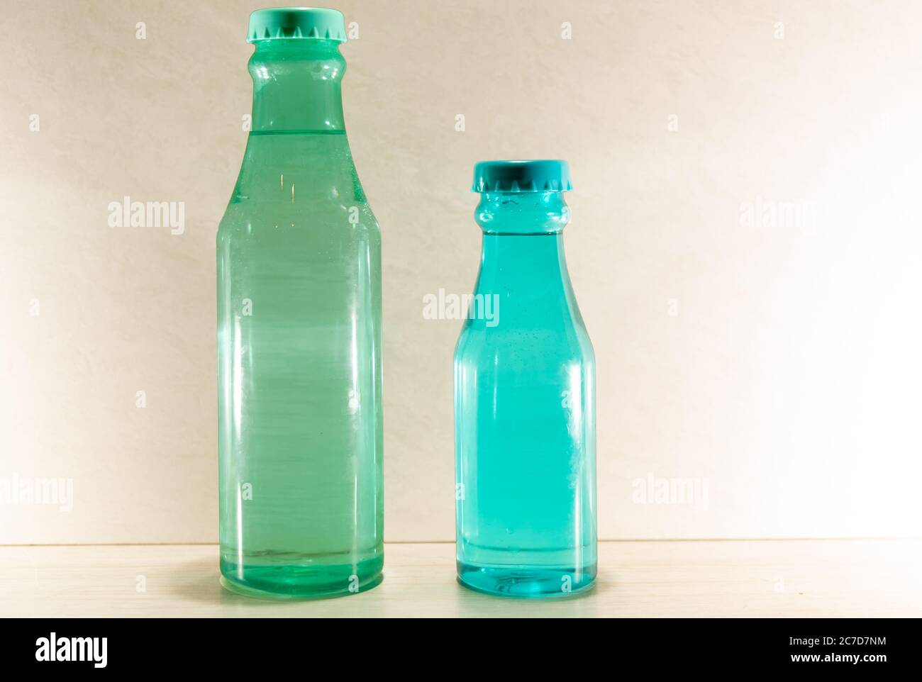 Colorful and decorative glass bottles. Decorated bottles can still be an excellent alternative for generating extra income. Handicrafts and housewares Stock Photo