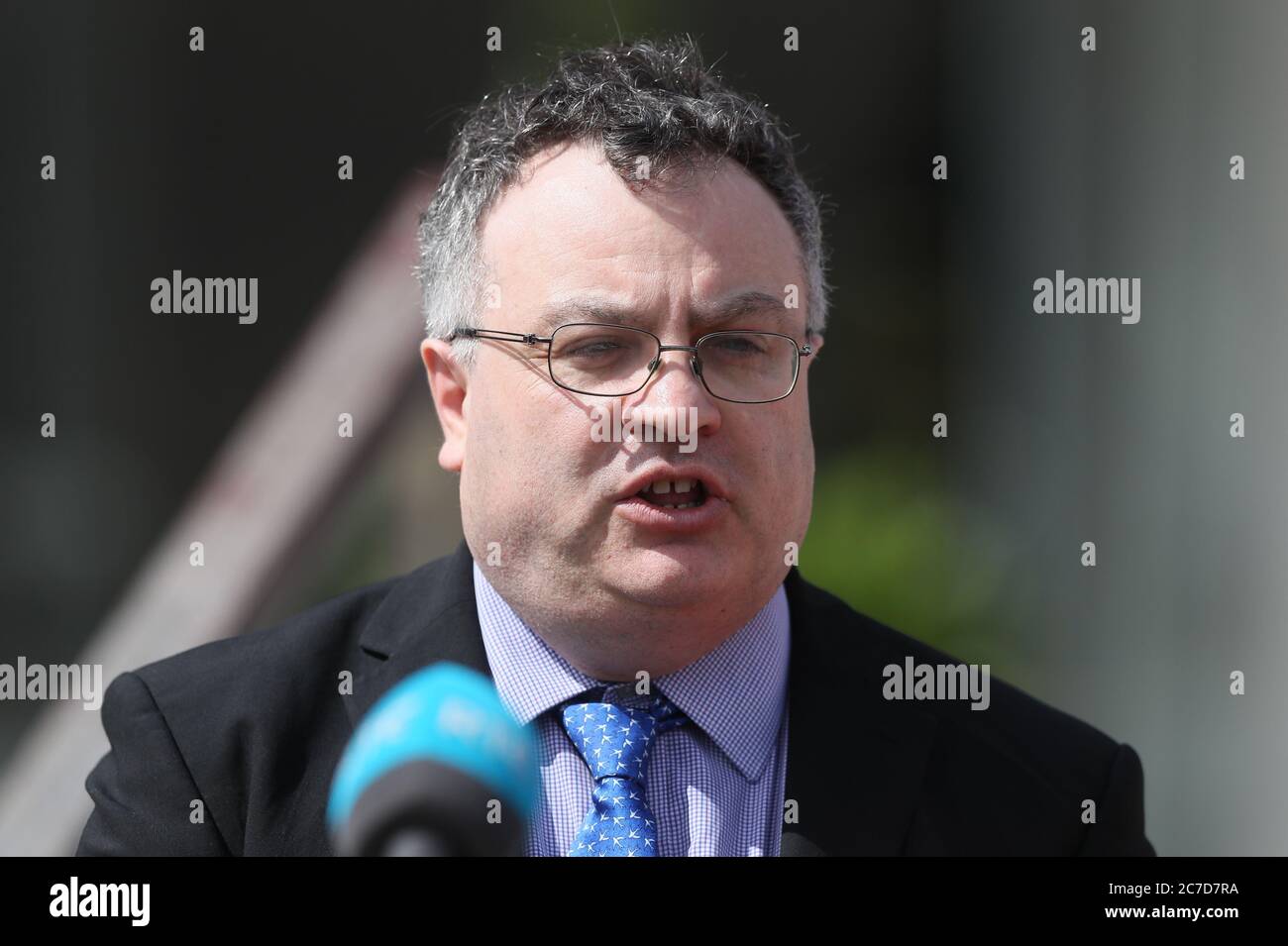 Deputy Leader of the Alliance Party, Stephen Farry speaks to media outside the Stormont Hotel in Belfast, Northern Ireland, after a meeting with Taoiseach, Micheal Martin. Stock Photo