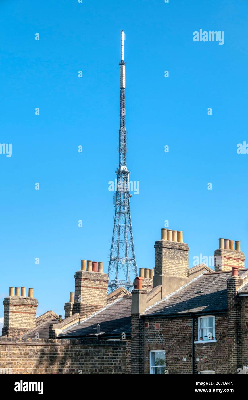 Crystal Palace TV aerial seen over rooftops of houses in south London. Stock Photo