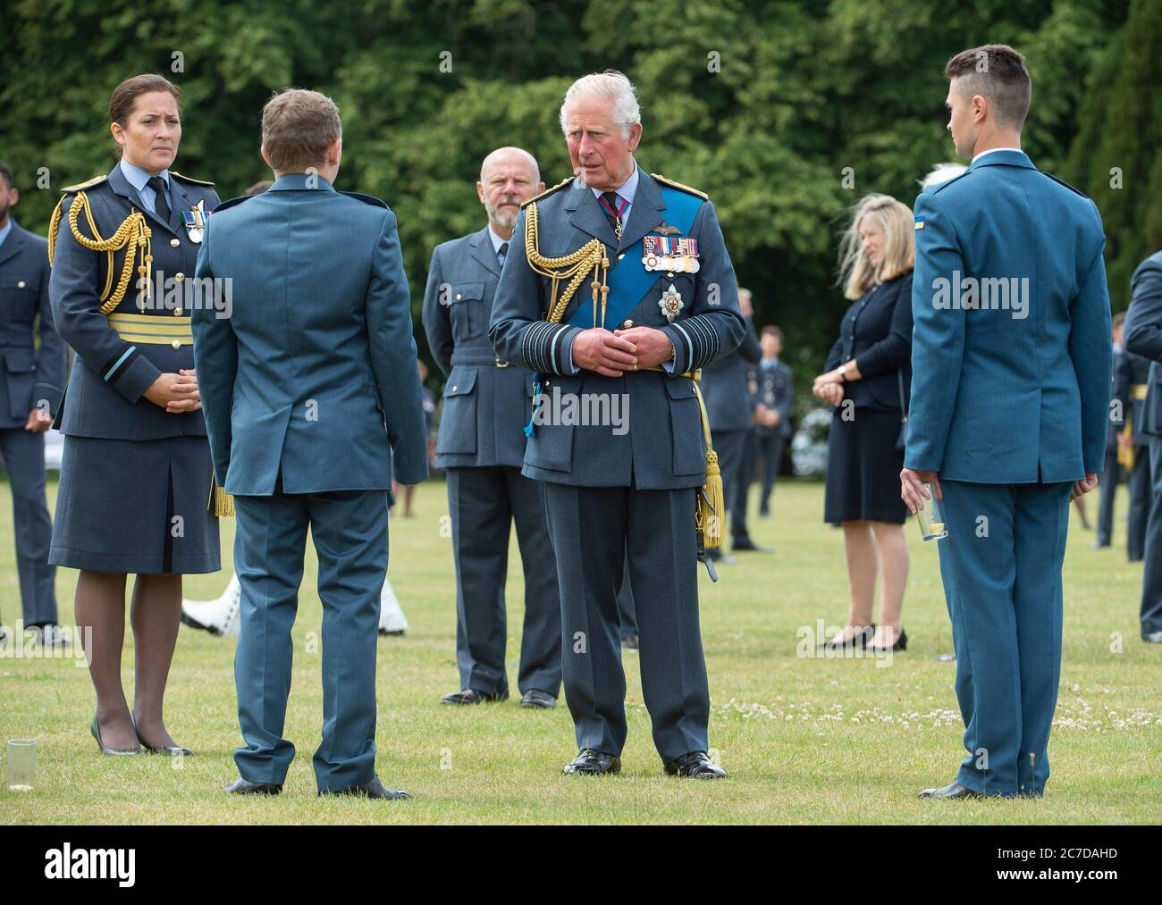 The Prince of Wales talks to graduates after attending the Graduation Ceremony of the Queen's Squadron at RAF College Cranwell, Lincolnshire. Stock Photo