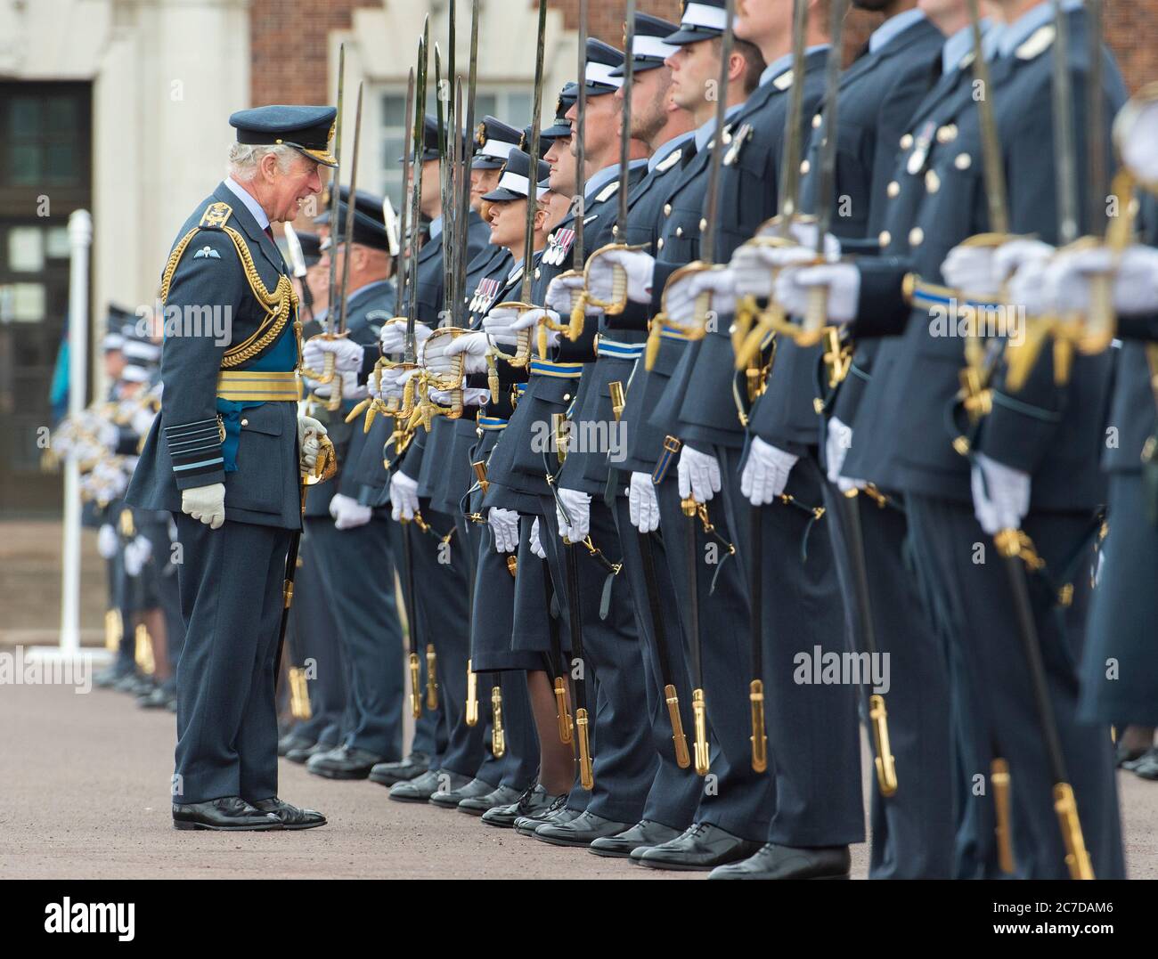 The Prince of Wales inspects the graduates during the Graduation Ceremony of the Queen's Squadron at RAF College Cranwell, Lincolnshire. Stock Photo