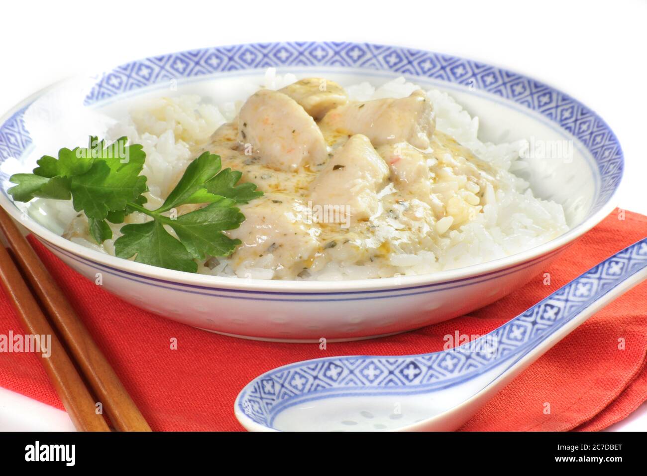 pieces of fish cooked in coconut milk and rice Stock Photo - Alamy