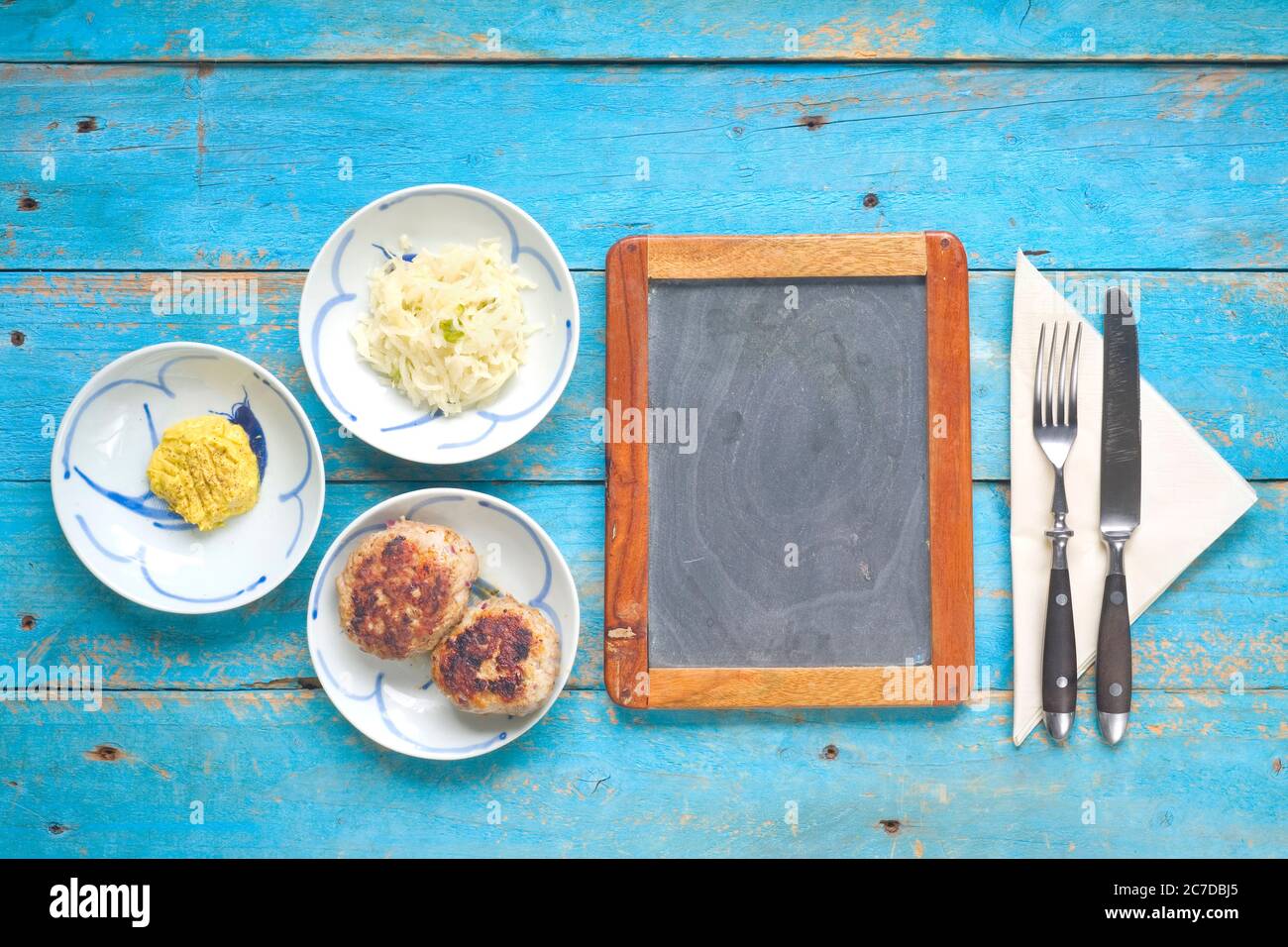 meatballs with sald and mustard,black board for menu Stock Photo