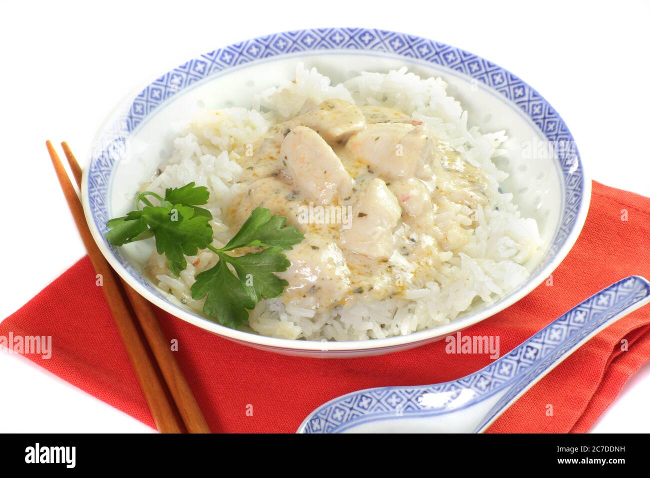 pieces of fish cooked in coconut milk and rice Stock Photo - Alamy