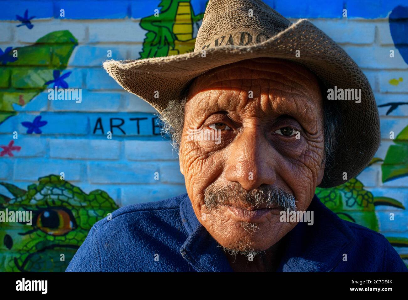 Old man and Wall street art graffiti in Concepción de Ataco Ahuachapán department El Salvador Central America. Ruta De Las Flores, Department Of Ahuac Stock Photo