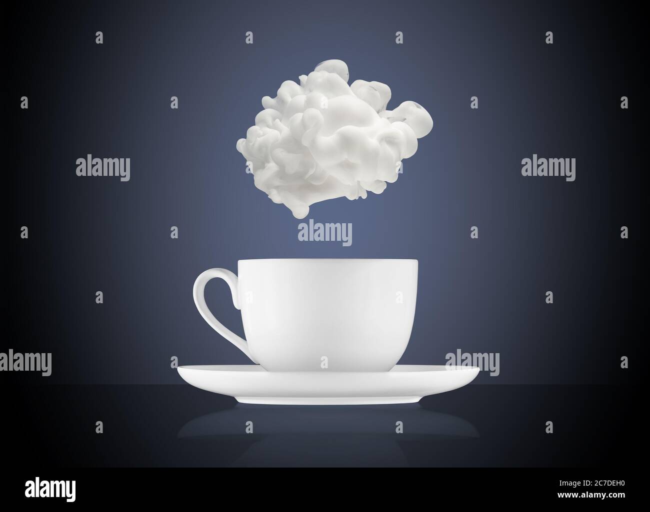 white cloud above a coffee cup on blue background Stock Photo