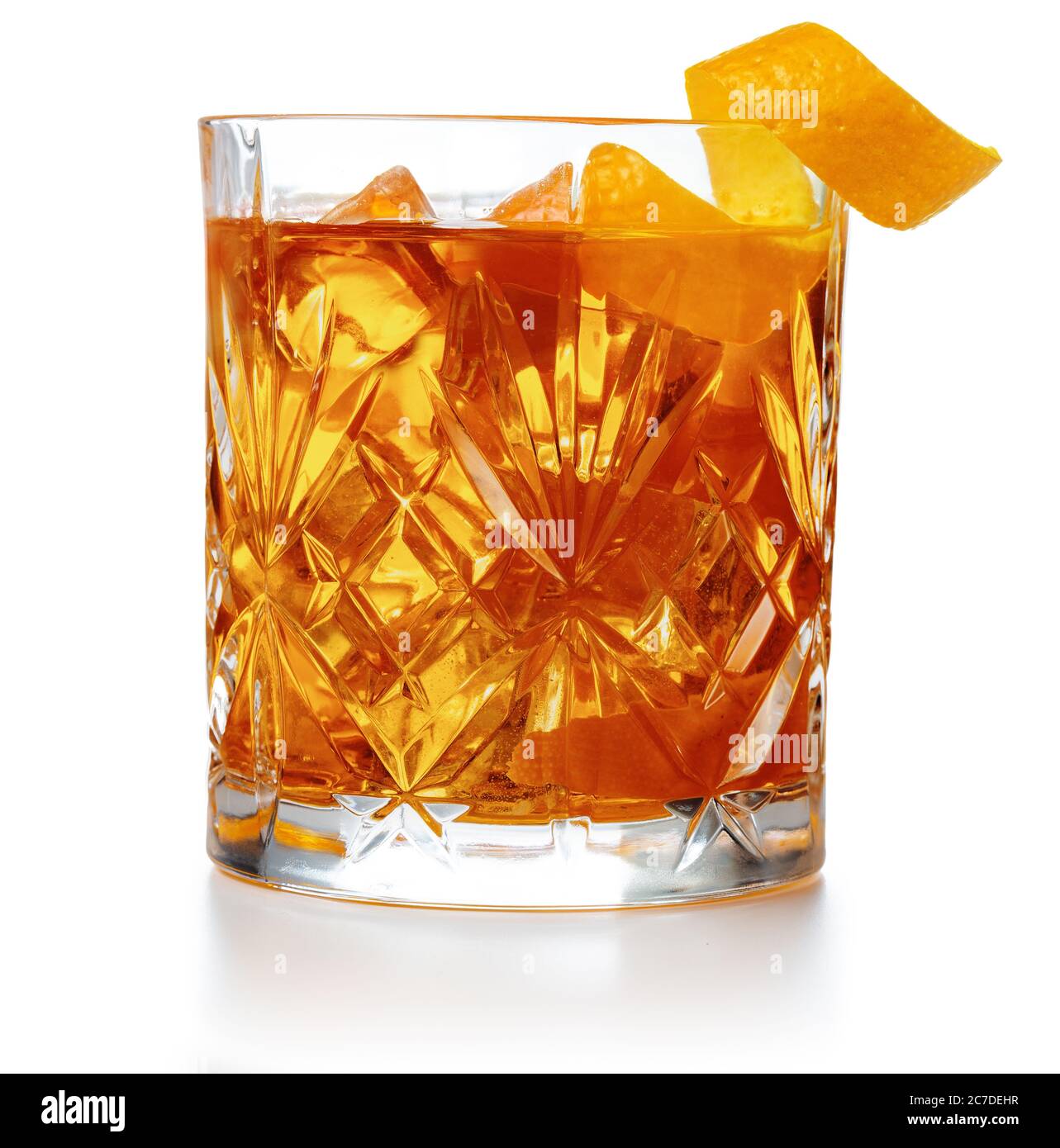 old fashioned cocktail garnished with orange twist peel isolated Stock Photo