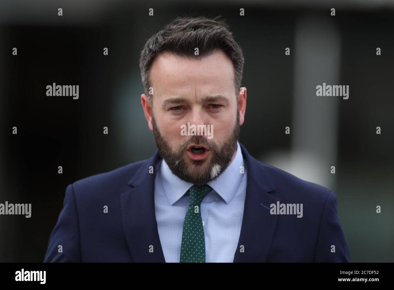 SDLP leader Colum Eastwood talks to the media outside the Stormont Hotel, Belfast, following meeting with An Taoiseach Micheal Martin. Stock Photo