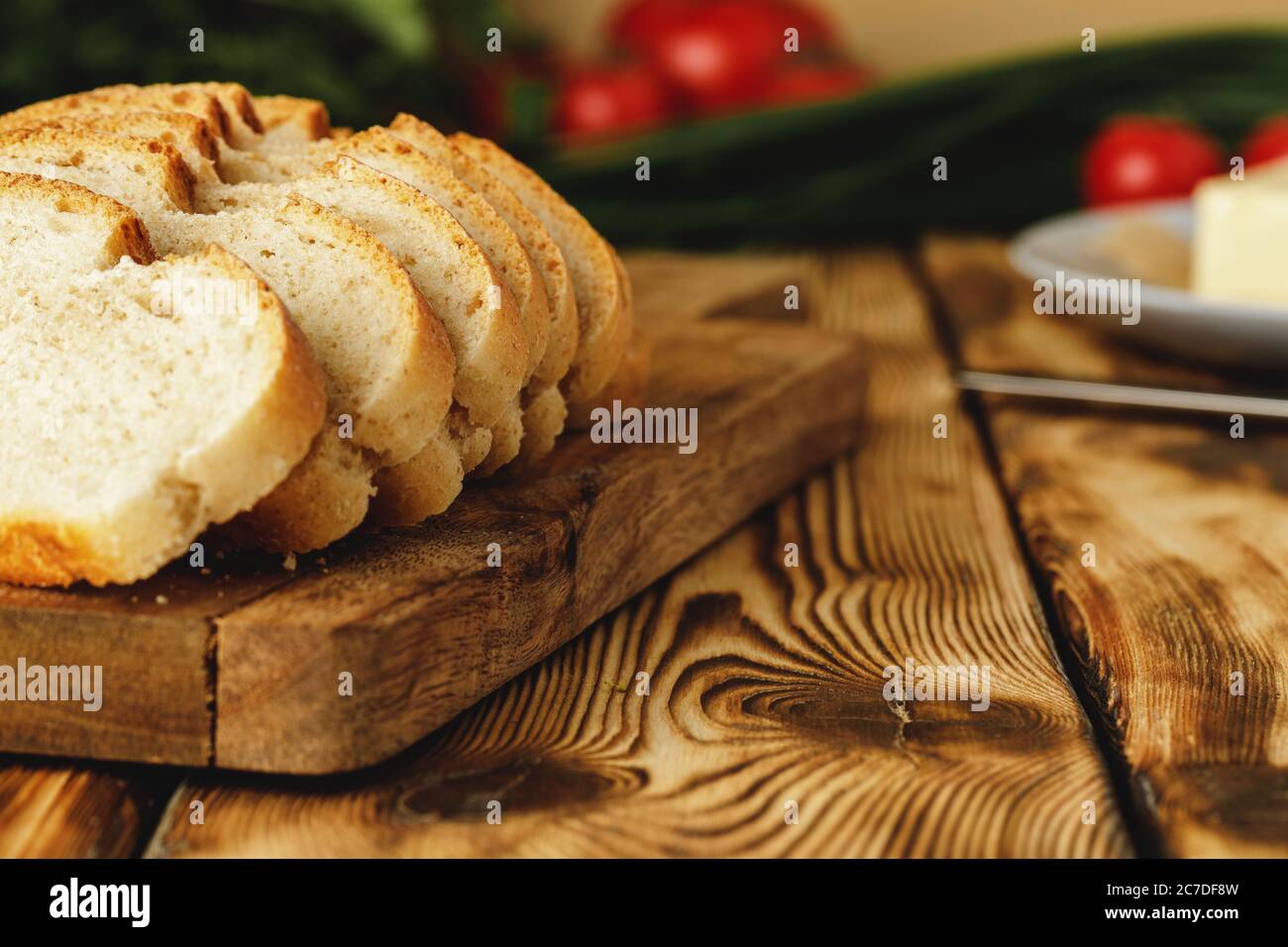 Fresh baked loaf of bread with butter bar Stock Photo Alamy