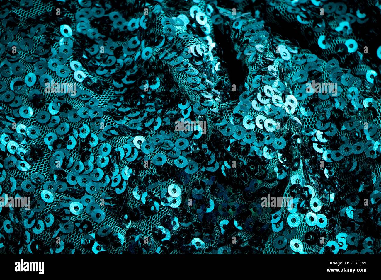 Turquoise shimmer sequined textured fabric Stock Photo