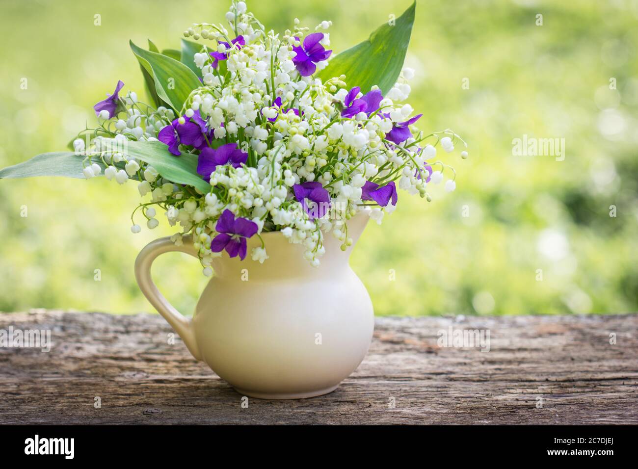 Beautiful bouquet of lilies of the valley and violets Stock Photo Alamy