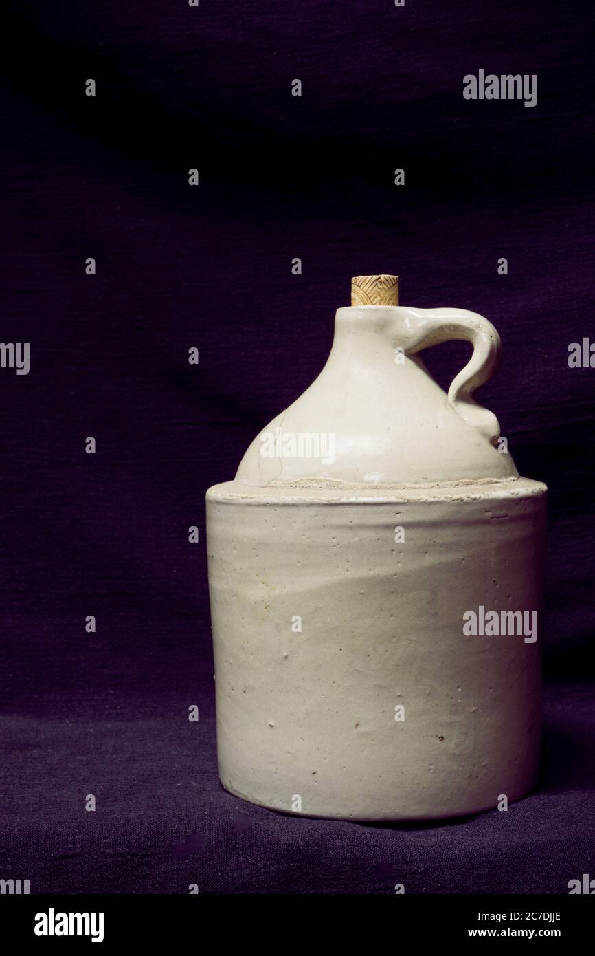 Antique and Old Fashioned White Whiskey Jug Stock Photo - Alamy
