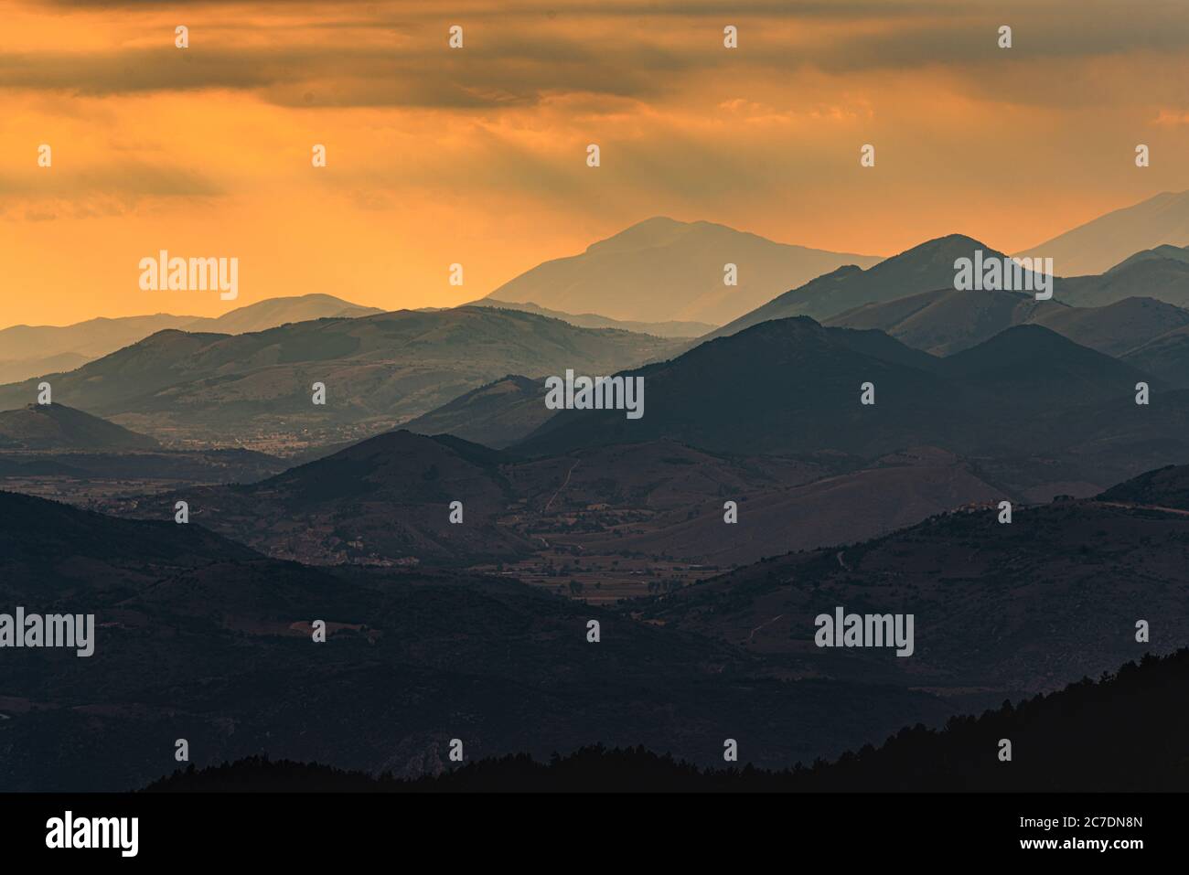 distant Gran Sasso mountain range at sunset Stock Photo