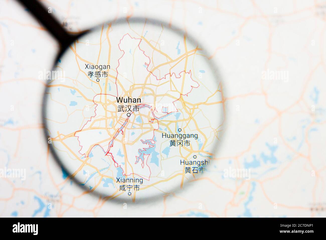 Wuhan, China city visualization illustrative concept on display screen through magnifying glass Stock Photo