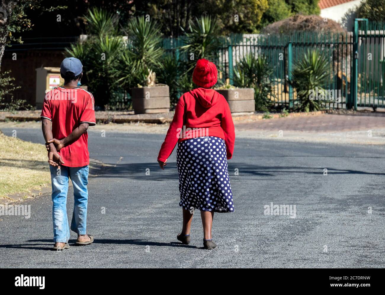 Alberton, South Africa - unidentified elderly black couple walking in a public street during lockdown for covid-19 image in horizontal format Stock Photo