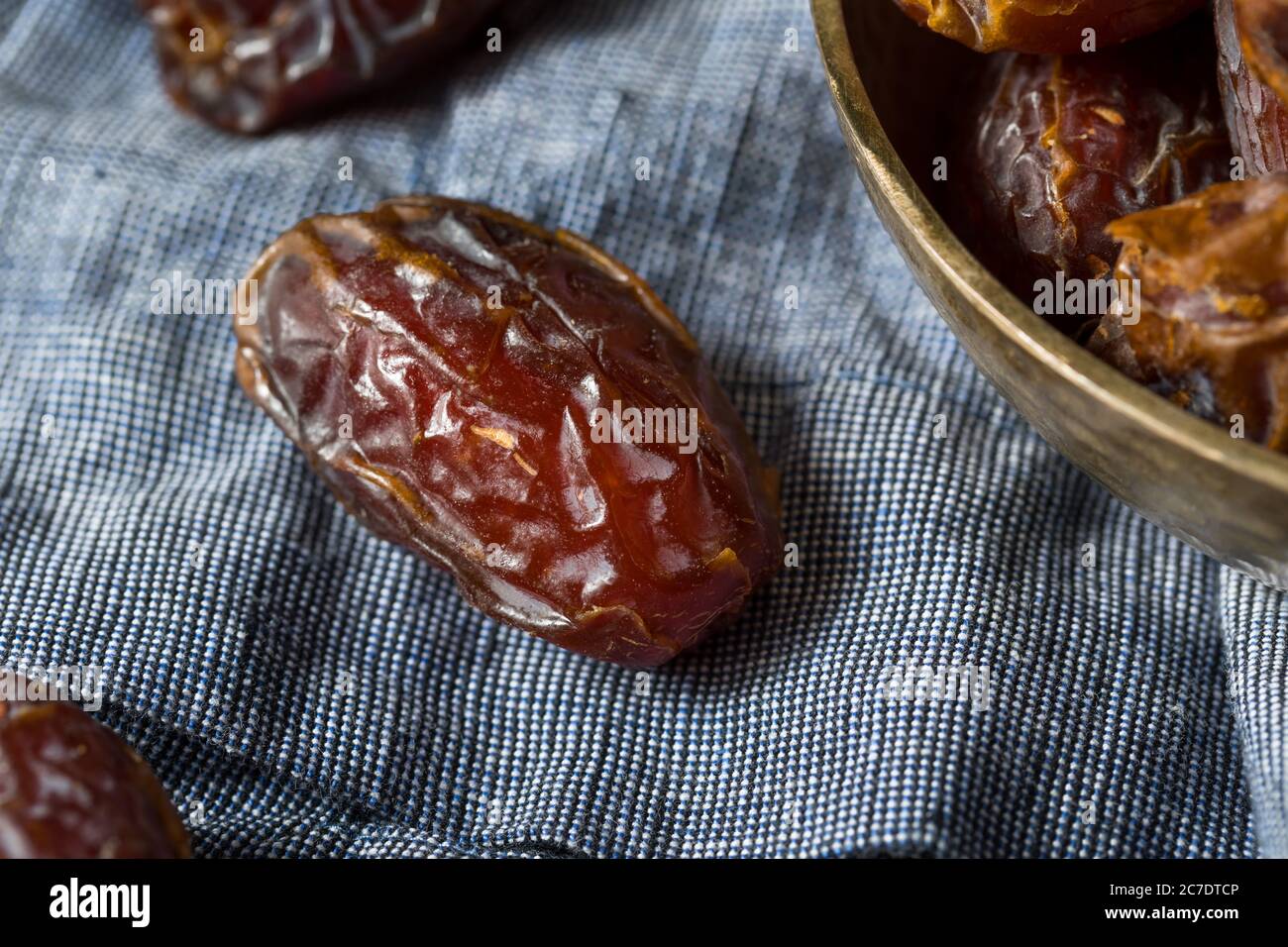 Organic Dry Red Dates in a Bowl Stock Photo