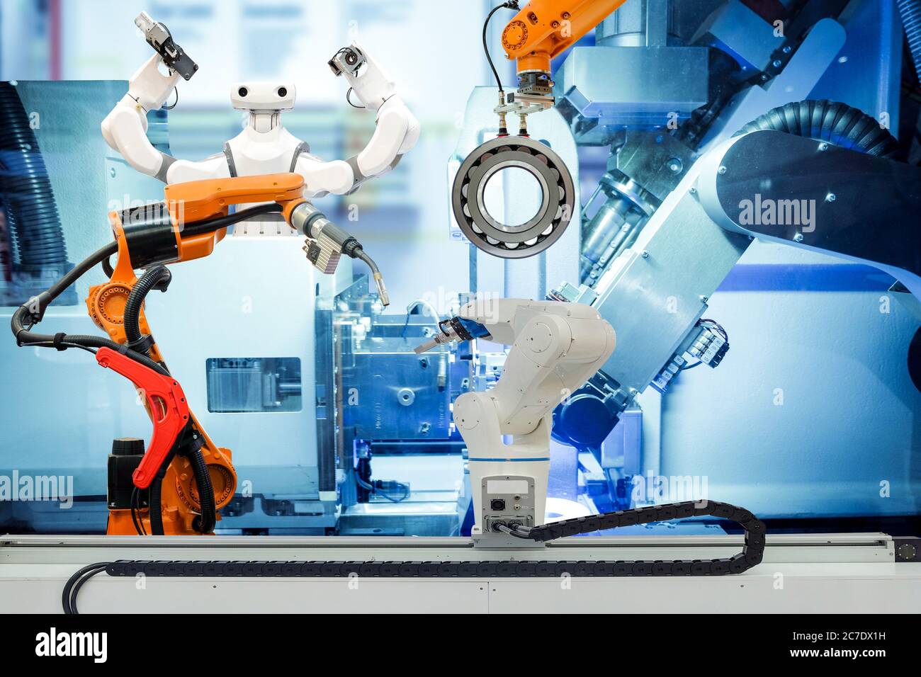 Industrial robotic working with metal part on smart factory, on machine blue tone color background, industry 4.0 and technology concept Stock Photo