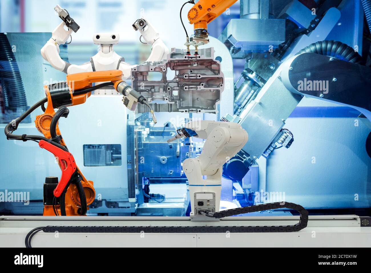 Industrial robotic working with metal part on smart factory, on machine blue tone color background, industry 4.0 and technology concept Stock Photo