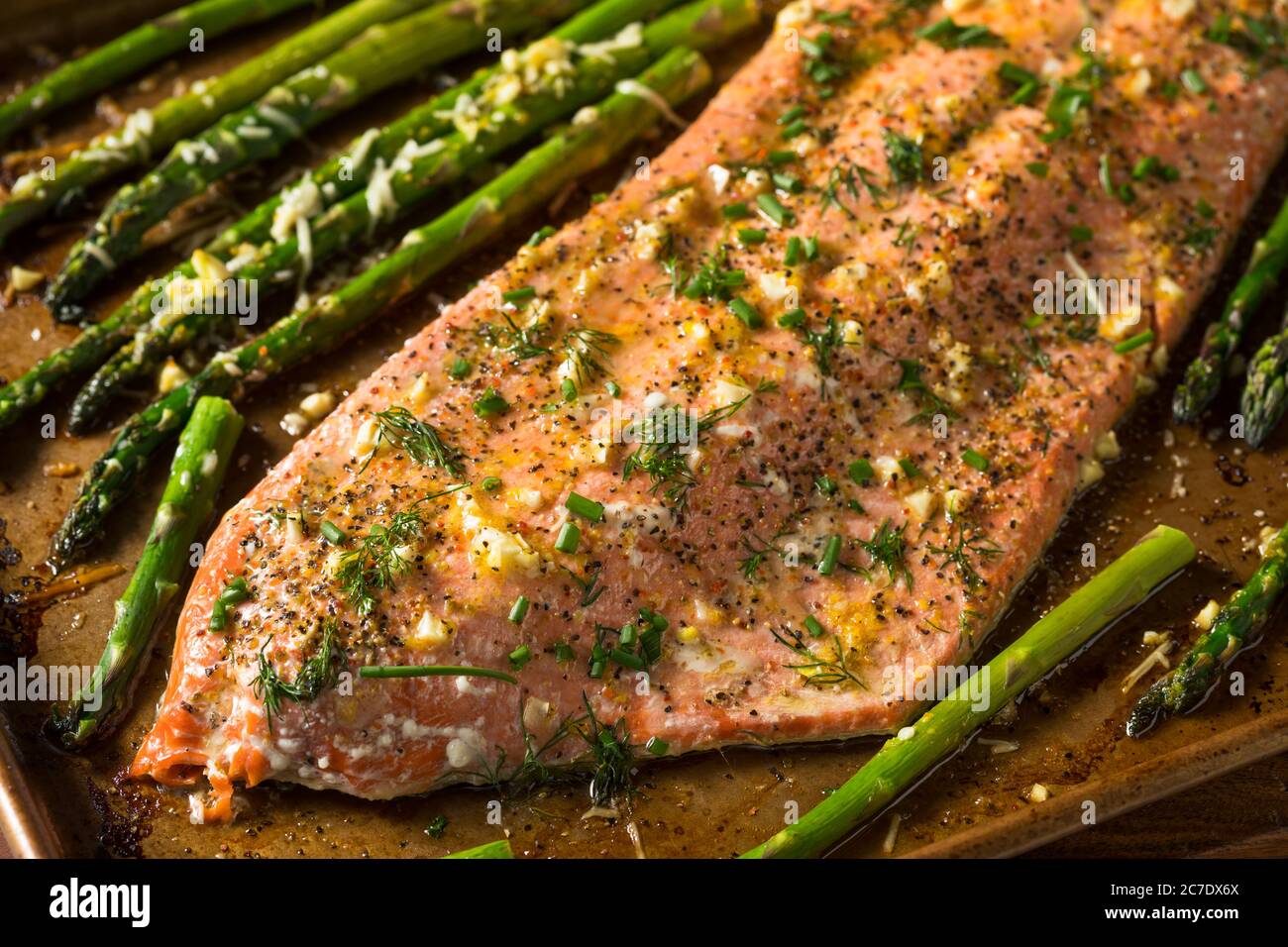 Homemade Roasted Salmon Filet and Asparagus with Garlic and Dill Stock Photo