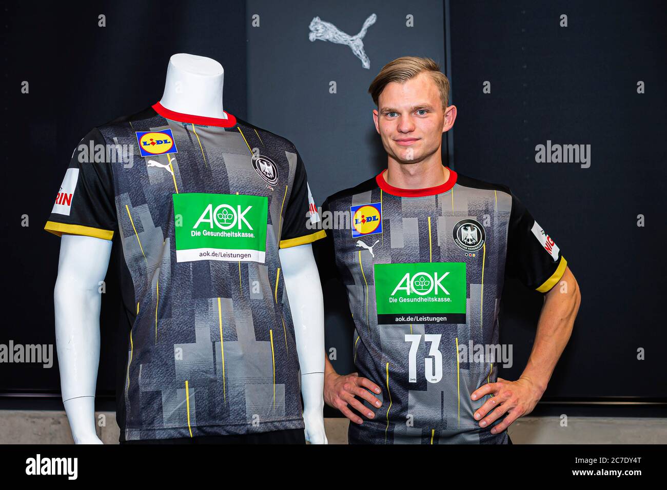 Heidelberg, Germany. 16th July, 2020. Handball, DHB: Shirt presentation of  the national teams. The German national player Timo Kastening (Germany/MT  Melsungen) stands between two fashion mannequins wearing the new team and  goalkeeper