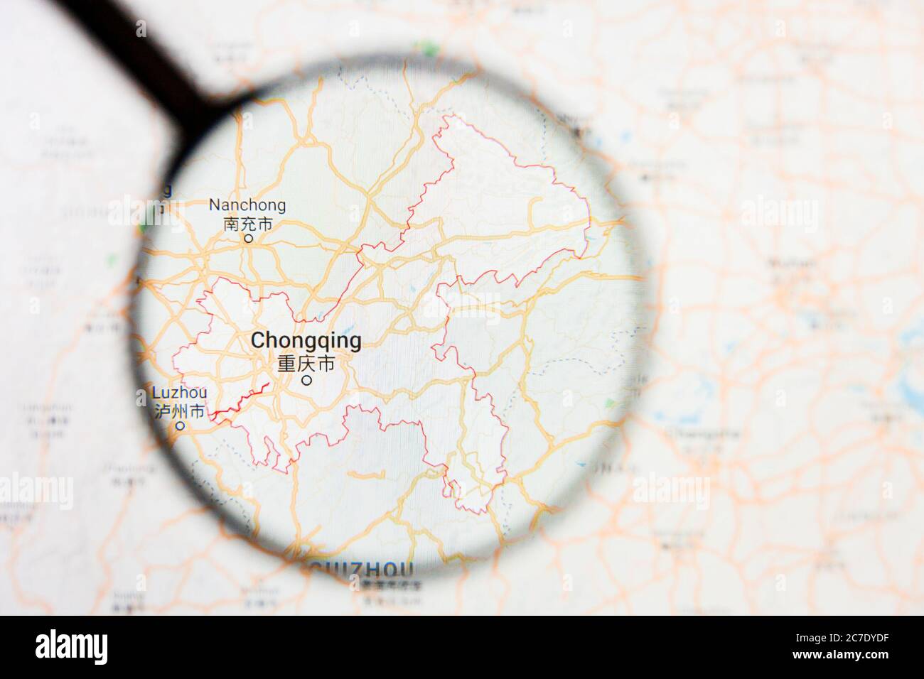 Chongqing, China city visualization illustrative concept on display screen through magnifying glass Stock Photo