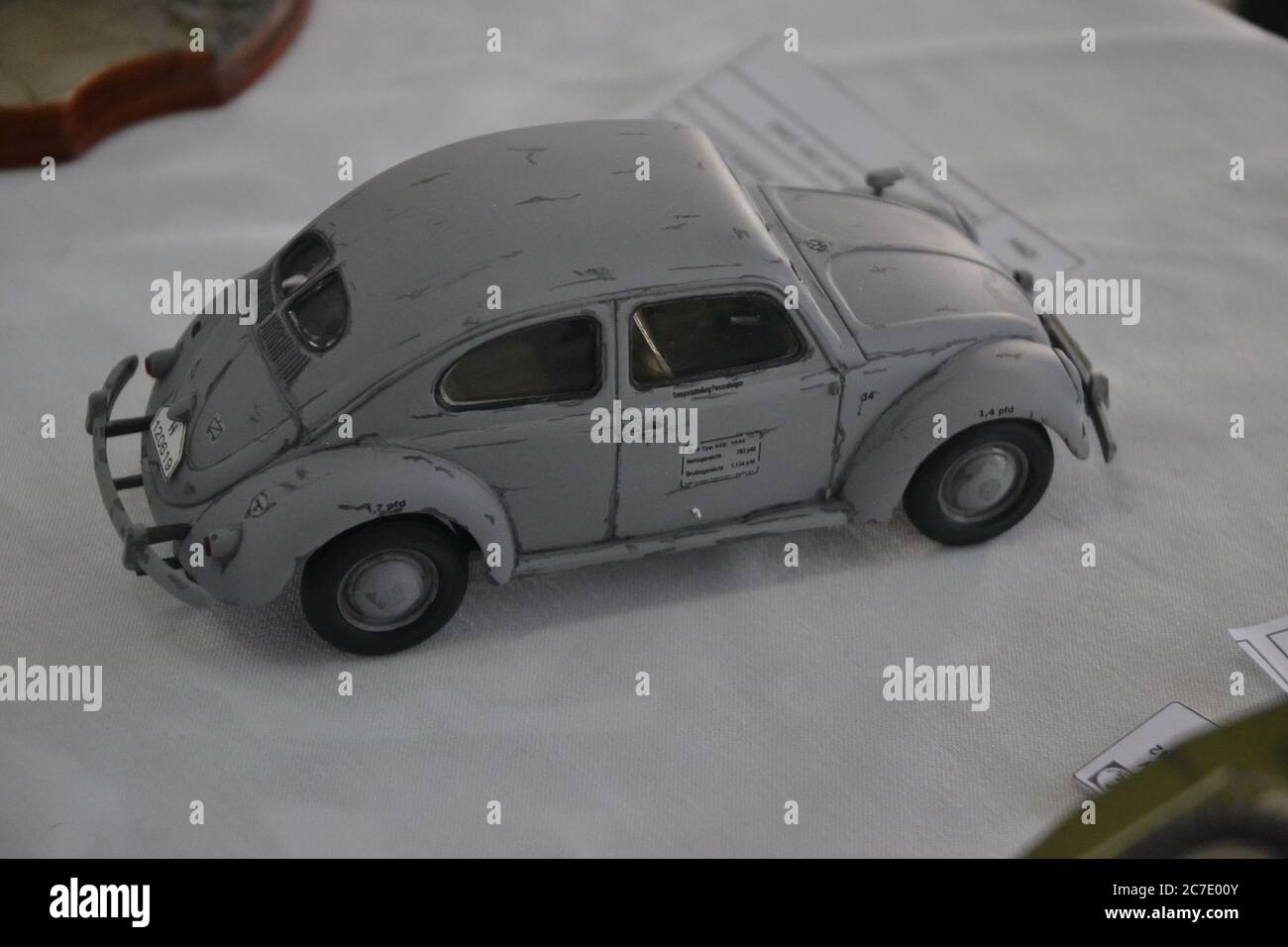 Miniature Beetle car. Plastic model miniature in white Beetle scale, white background, on display in Brazil, South America Stock Photo