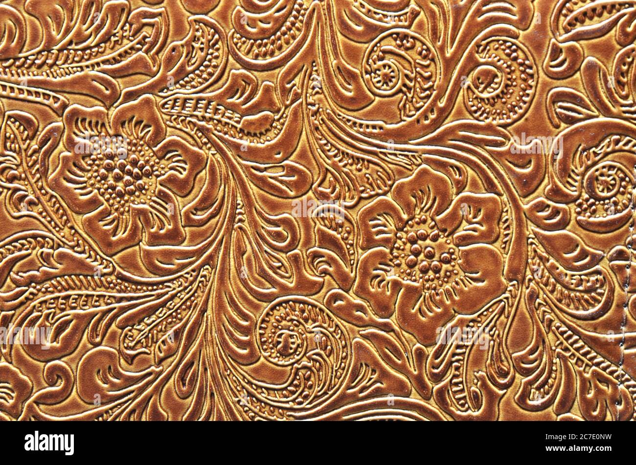 Close Up Photo Of A Tooled Or Embossed Floral Pattern On Colorful Warm Rust Colored Leather Stock Photo Alamy