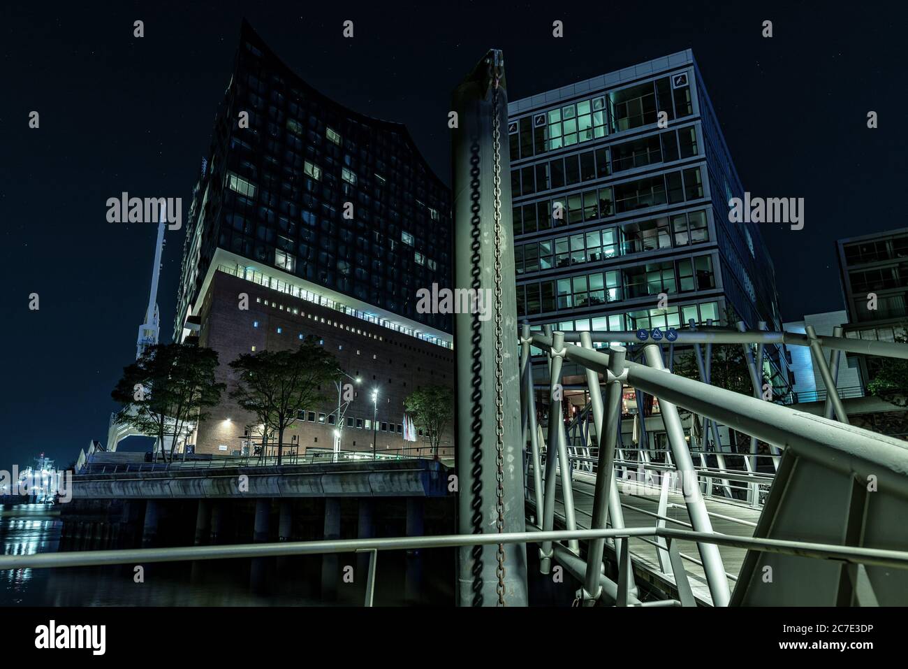 Low angle shot of two modern buildings with a bridge leading to them ...