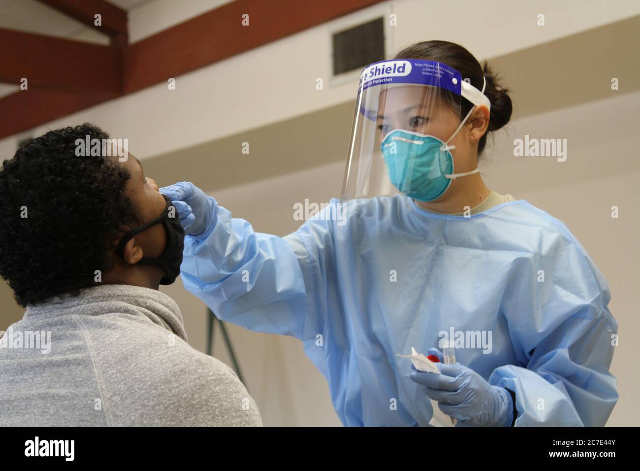 U.S. Air Force medic SSgt. Michiko Imai of the California Air National Guard administers a COVID-19 test to a Northern California resident at Robertson Community Center July 15, 2020in Sacramento, California. Stock Photo