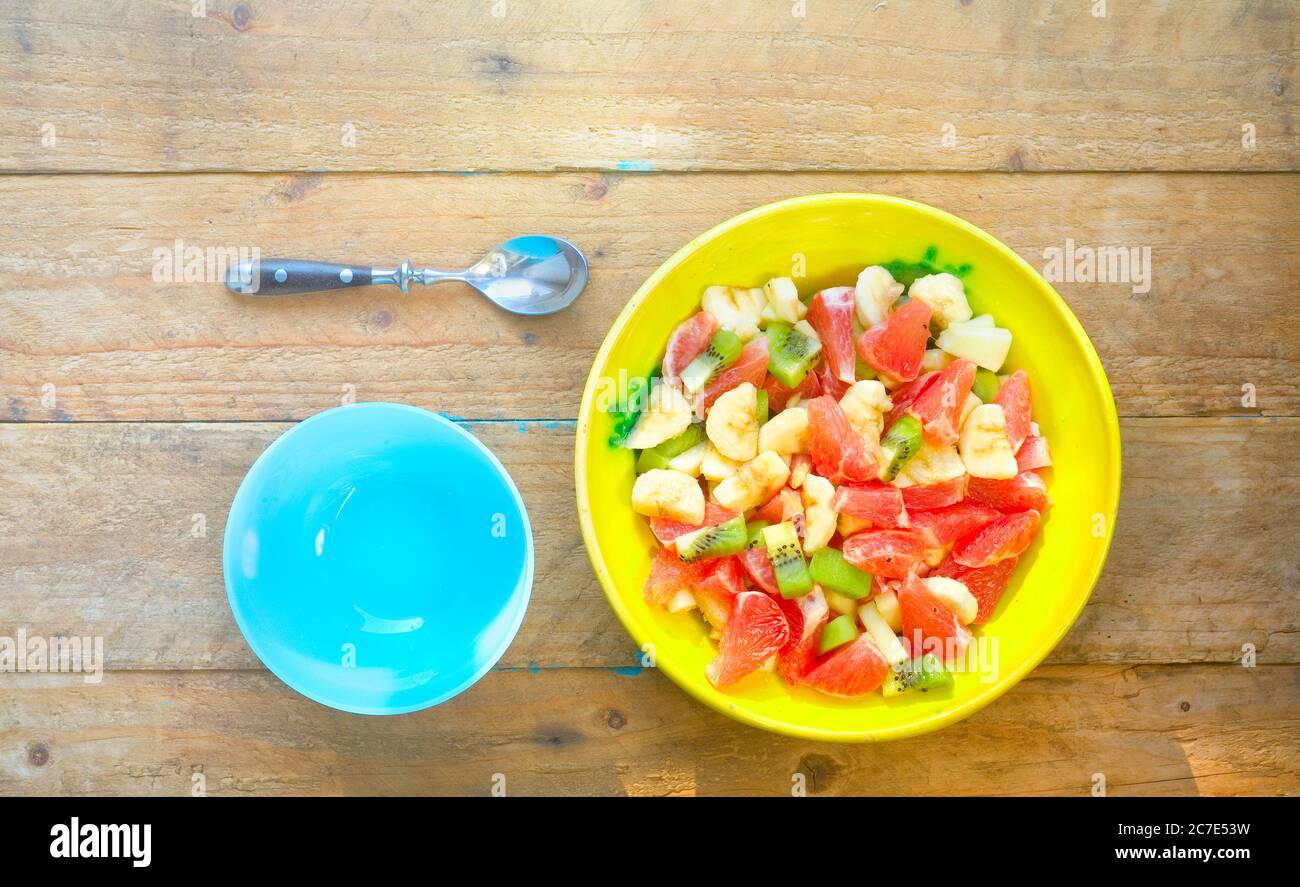 fruit salad in bowl, flat lay, vitamin, healthy food concept, good copy space Stock Photo
