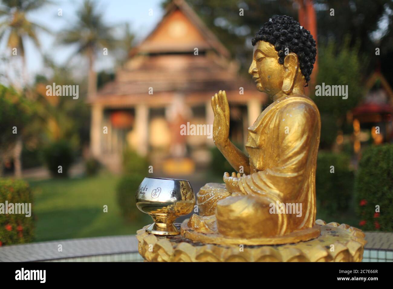 Closeup shot of a golden Buddha statue in a Thai temple in Malaysia. Great for religious scenarios Stock Photo