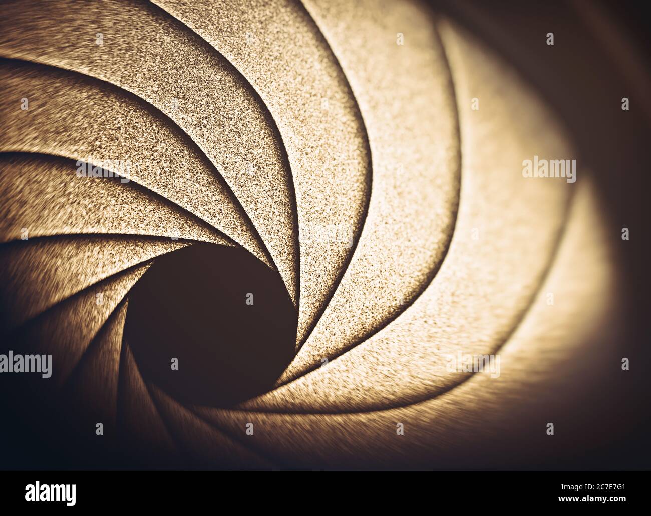 Macro photography from inside an objective lens and its details like the diaphragm blades. Reflection of the sky in the camera lens. Stock Photo