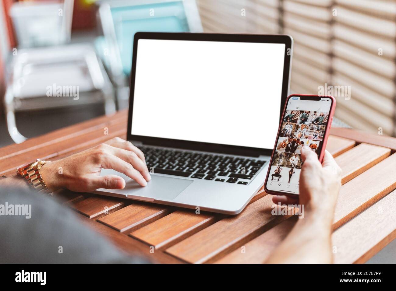 Using the phone and and computer at the same time hi-res stock ...