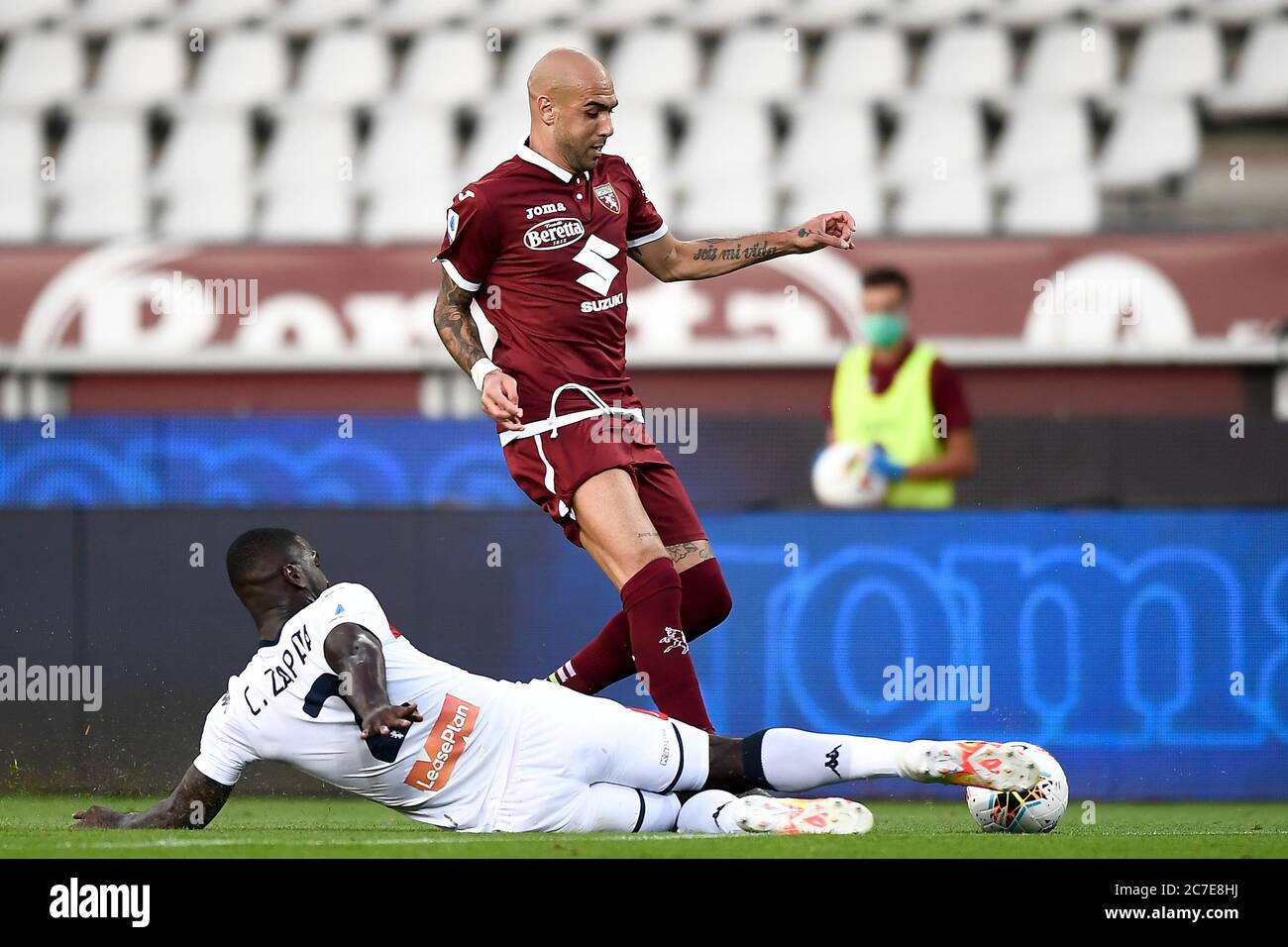 Turin, Italy. 16th July, 2020. TURIN, ITALY - July 16, 2020: Simone Zaza of Torino FC is tackled by Cristian Zapata of Genoa CFC during the Serie A football match between Torino FC and Genoa CFC. (Photo by Nicolò Campo/Sipa USA) Credit: Sipa USA/Alamy Live News Stock Photo