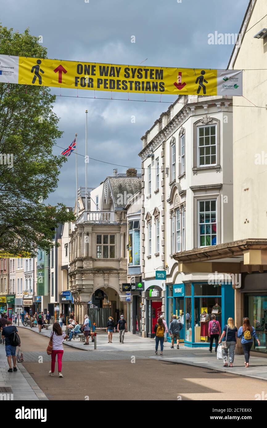 Exeter, Devon, England. Thursday 16th July 2020. UK Weather. The people of Exeter in Devon observe the government's advice to 'social distance', with many of them also opting to wear face masks, whilst out shopping in the town centre. Credit: Terry Mathews/Alamy Live News Stock Photo