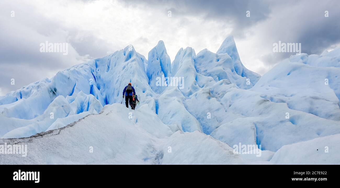 Two climbers near the top of Perito Moreno glacier in Argentina Stock Photo