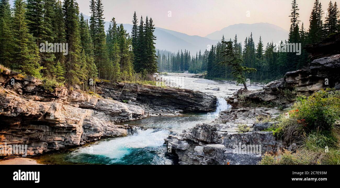 Small waterfall beautiful Canadian pine forest Stock Photo
