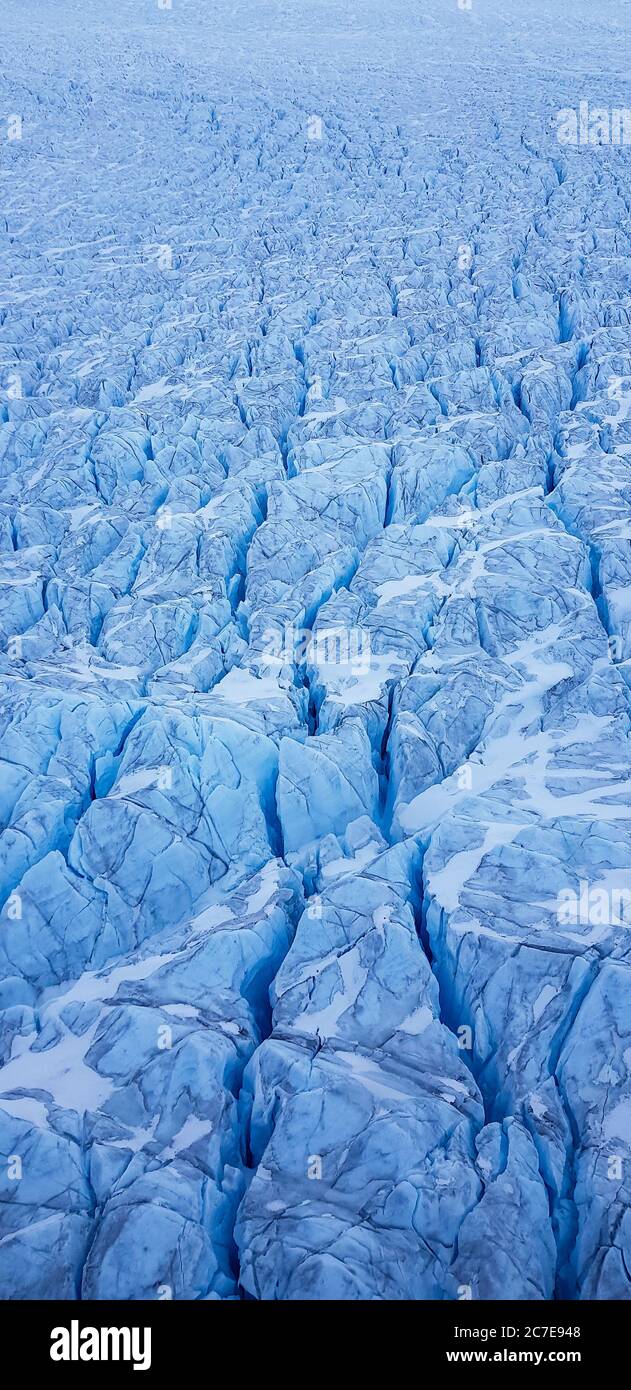 Aerial of glacier in Greenland with glacial rivers and lakes Stock Photo