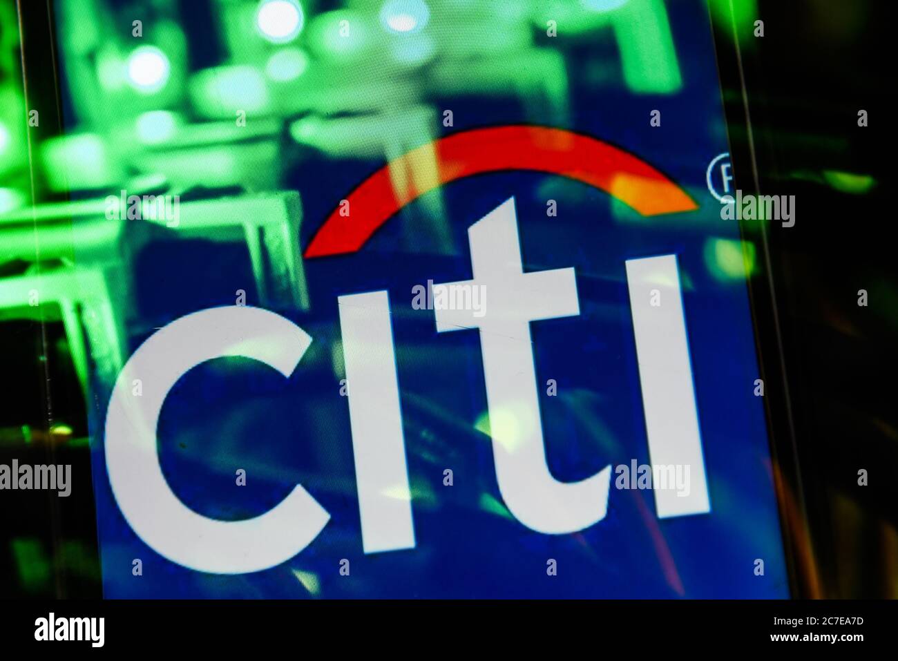 In this photo illustration, a Citibank logo seen displayed on a smartphone  in front of Citigroup stock price and a graph Stock Photo - Alamy