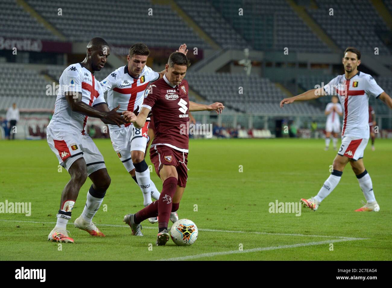 16th July 2020; Olympic Grande Torino Stadium, Turin, Piedmont, Italy; Serie A Football, Torino versus Genoa; Armando Izzo of Torino FC shields the ball from Cristian Zapata and Paolo Ghiglione of Genoa FC Credit: Action Plus Sports Images/Alamy Live News Stock Photo