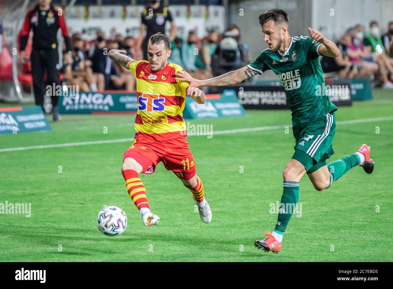 Jesus Imaz Of Jagiellonia Bialystok And Mark Tamas Of Slask Wroclaw Are Seen In Action During
