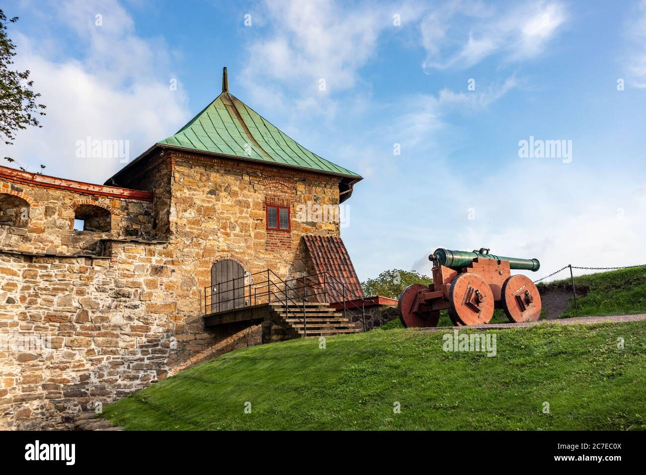 Artillery gun in Medieval castle Akershus Fortress on bright sunny autumn day in Oslo, Norway. European fort structure landmark Stock Photo