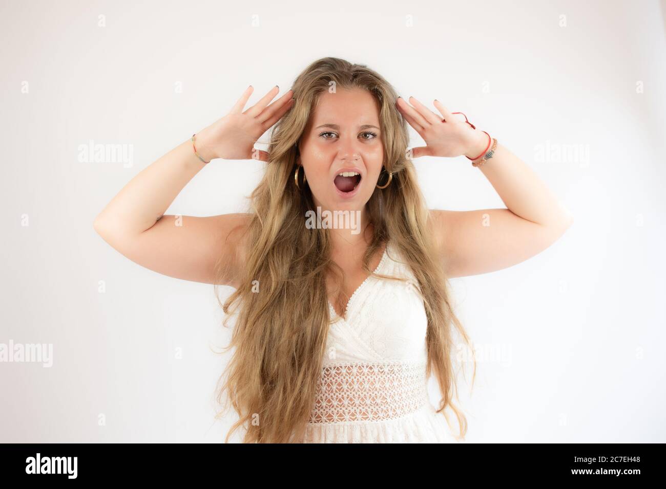 Angry young woman raising hand hi-res stock photography and images - Alamy
