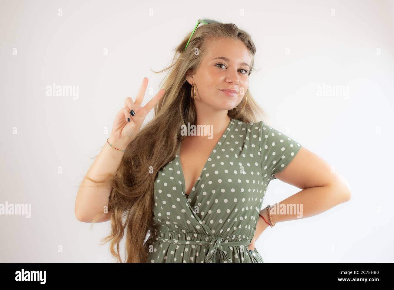 Portrait of a pretty young girl in green dress Stock Photo - Alamy
