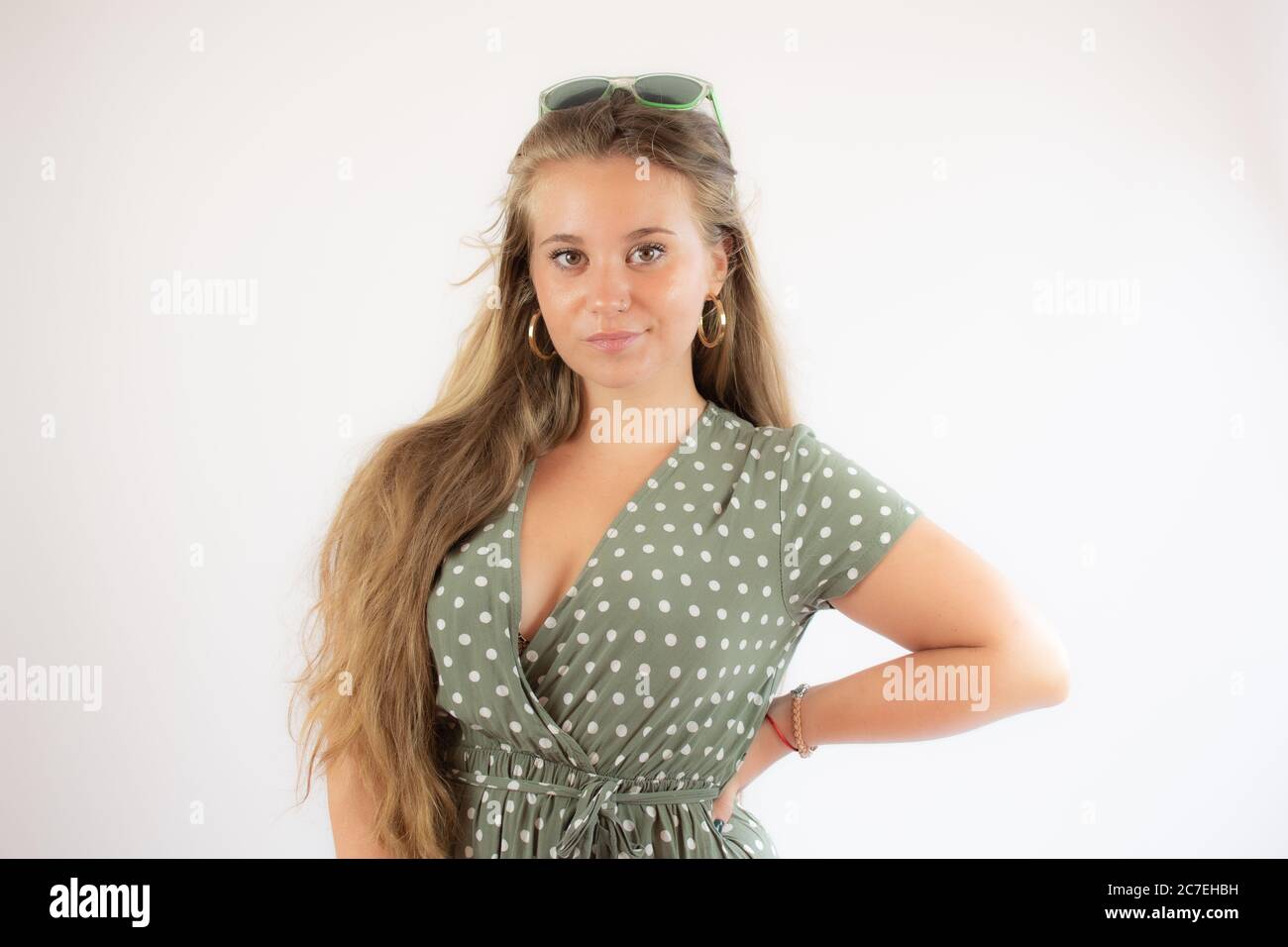 Portrait of a pretty young girl in green dress Stock Photo - Alamy