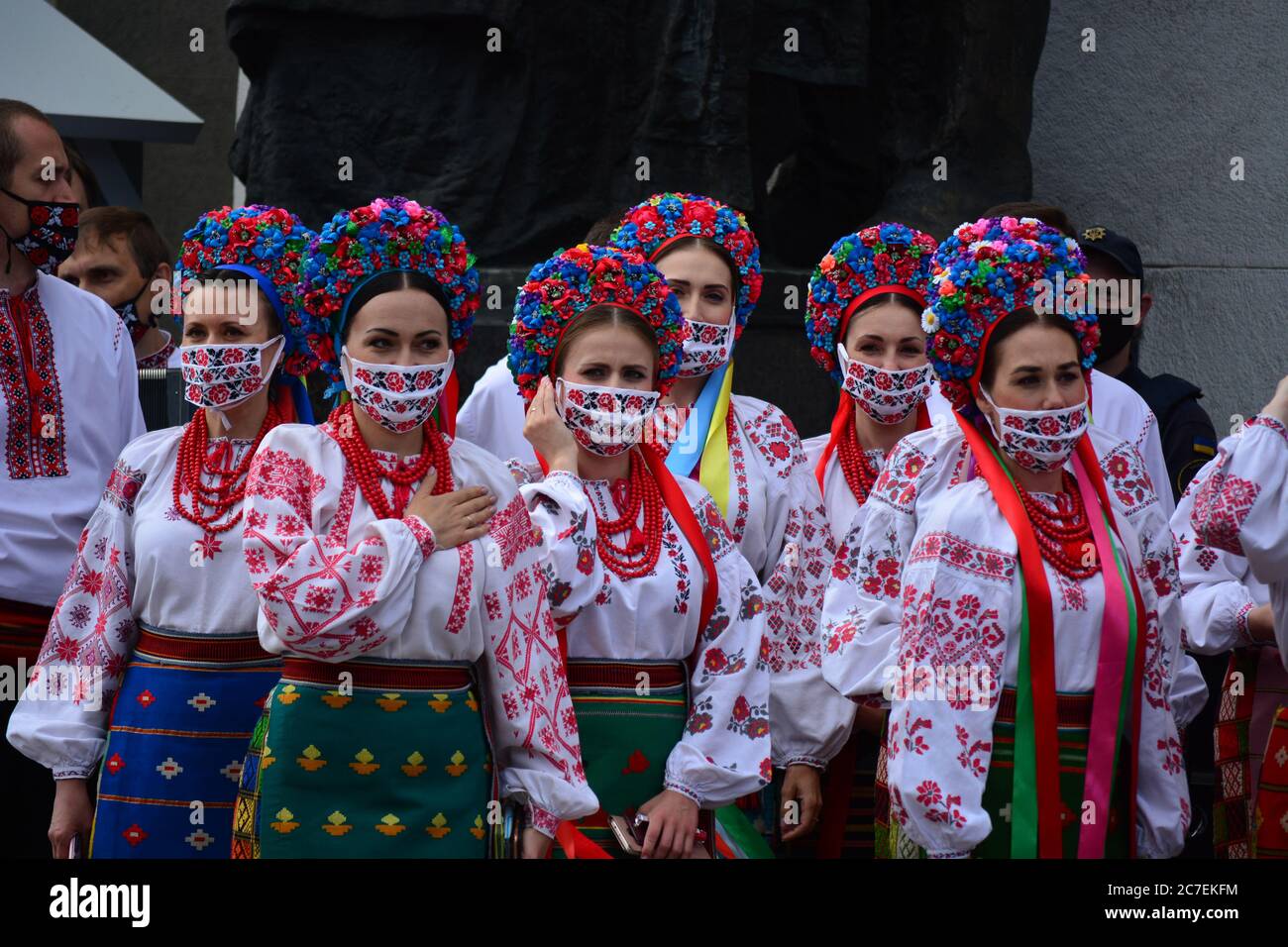 Coronavirus outbreak: Government prolongs adaptive quarantine until July 31 in Ukraine. Members of the Ukrainian national choir in folk costumes and e Stock Photo