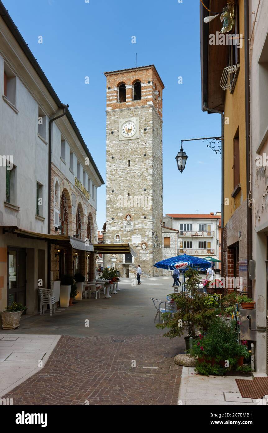 MARANO LAGUNARE, Italy - June 9, 2013: View of the historic Millenaria (thousand-year old) tower from an elegant street Stock Photo