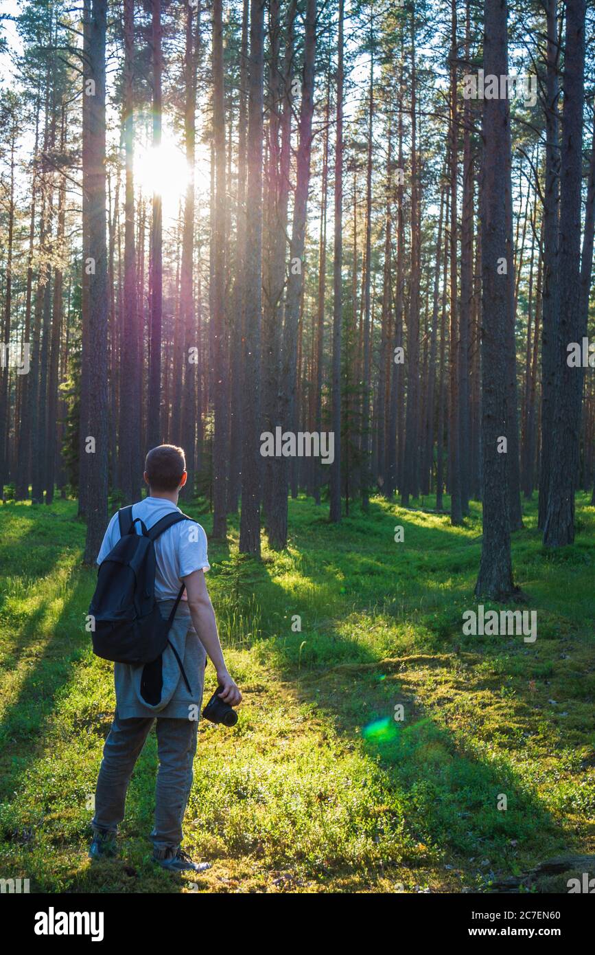 Photographer Stands In A Beautiful Green Forest Stock Photo Alamy