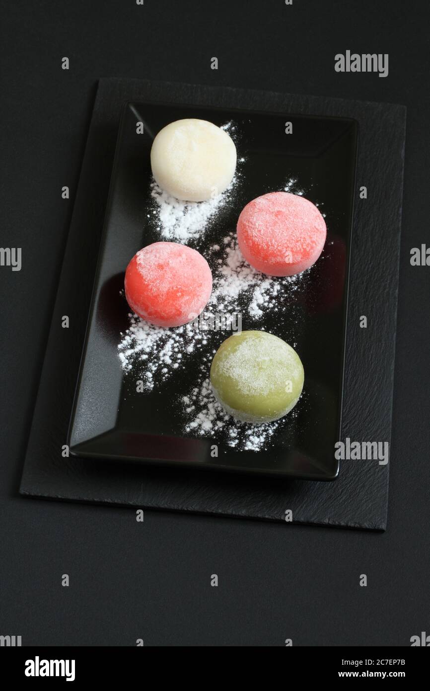 Four types of Japanese dessert mochi - pomegranate with honey, green ...