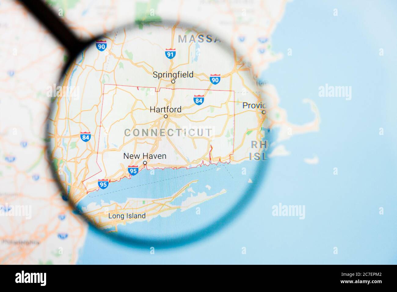Los Angeles, California, USA - 15 March 2019: Connecticut, CT state of America visualization illustrative concept on display screen through magnifying Stock Photo